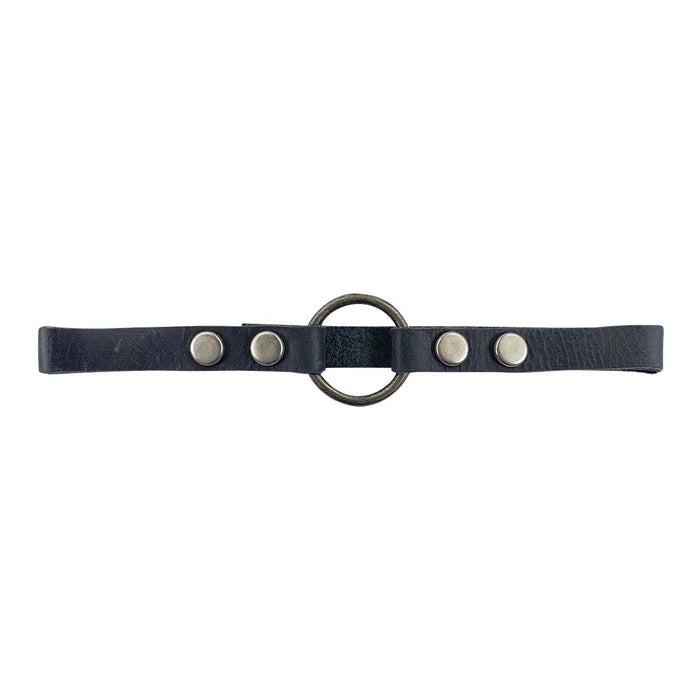 Close-up view of the Goth Choker by Hide & Drink featuring a sleek black leather strap alongside prominent metal hardware, representing a fashionable punk-style accessory. Goth Choker - Stylish Necklace, Trendy Accessory, Soft, Durable Collar - Punk Style with Metal Ring and Hardware, Adjustable, Full Grain Leather, StockyardX, Small Batch Production, Hand Cut, Hand Sewn, Fire Branded, Artisan, Handmade in La Antigua Guatemala & Oaxaca Mexico.