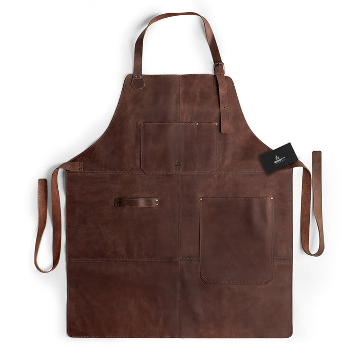 Front view of the Grill Apron by Cast Leather Co., featuring functional design elements, ideal as a Protective Clothing Cover for Cooking and Grilling. This Heat Resistant Full Grain Leather apron is perfect for any cooking enthusiast, showcasing Artisan craftsmanship. Handmade in La Antigua Guatemala & Oaxaca Mexico, it represents Small Batch Production and high-quality, Hand Sewn construction.