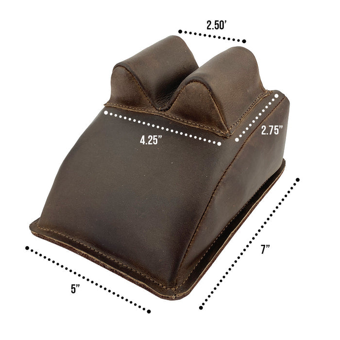 Hide & Drink Guitar Neck Rest with measurements displayed, perfect for string changing and repair care of instruments. Crafted from robust full grain leather, it exemplifies small batch artisan work, hand cut and sewn in La Antigua Guatemala and Oaxaca Mexico, ideal for musicians.
