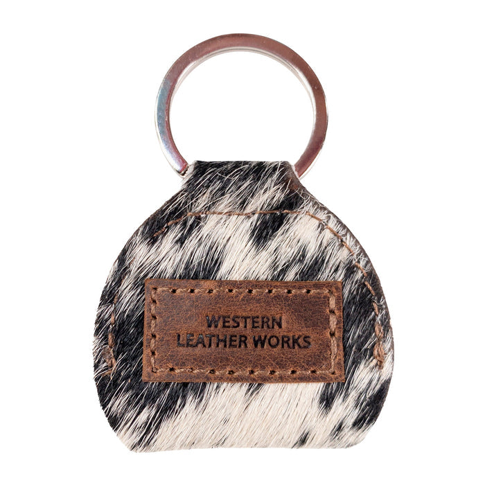 Stylish Guitar Pick Holder by Western Leather Works with a leather tag, made of Hair On Hide Full Grain Leather. A perfect example of small batch production, hand cut, hand sewn, and fire branded, showcasing artisan quality, handmade in La Antigua Guatemala & Oaxaca Mexico.