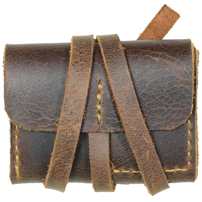 Hide & Drink Guitar Pick Roll neatly wrapped in leather straps, emphasizing its rustic charm and durability. This Guitar Pick Roll, a great Guitarist Gift and Musician Accessory, is crafted from Full Grain Leather with Small Batch Production techniques. Hand Cut and Hand Sewn by artisans in La Antigua Guatemala & Oaxaca Mexico.