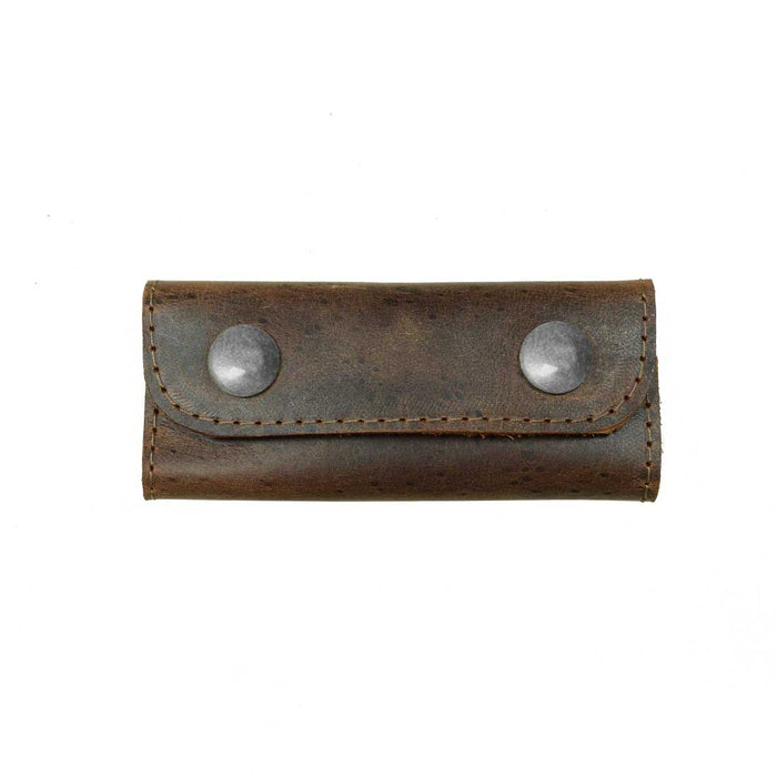 The Hide & Drink Handle Grip Replacement displayed flat, highlighting its unique stitching and durable snaps. This finely crafted Full Grain Leather piece is perfect for those who appreciate handmade travel accessories that combine functionality with artisan quality. It’s a great choice for any Handle Grip Replacement.