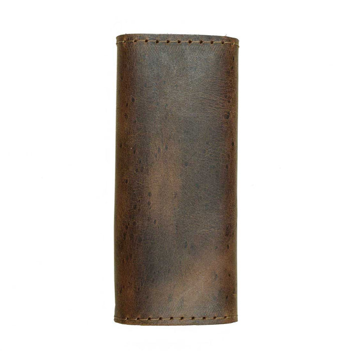 A detailed view of the Hide & Drink Handle Grip Replacement, emphasizing its texture and craftsmanship that enhance any luggage bag. This Full Grain Leather product is emblematic of the brand's commitment to handmade quality, making it an excellent Handle Grip Replacement for travelers.