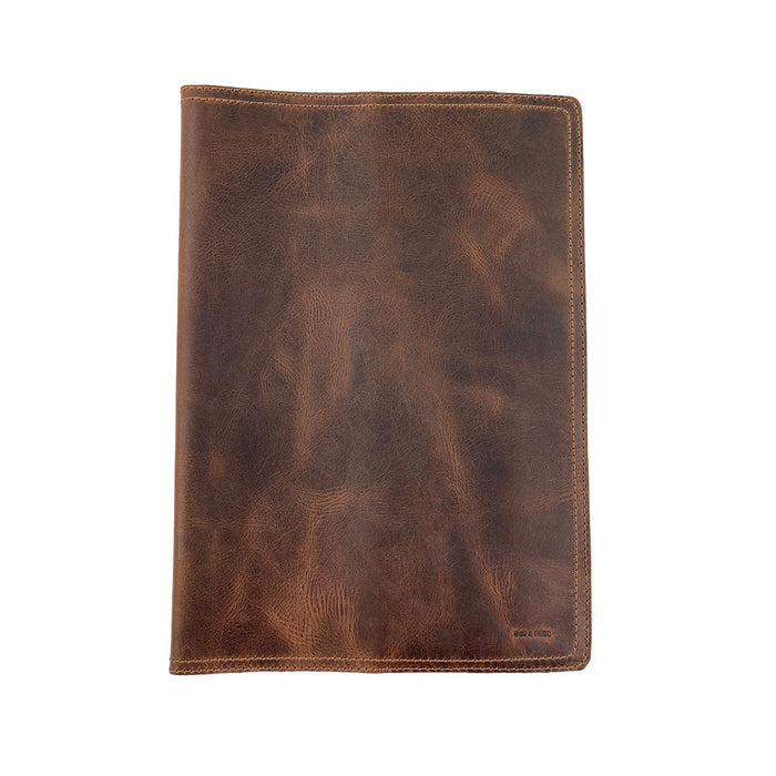 The exterior view of the Hard Cover Notebook Protector (Notebook NOT Included) by Hide & Drink, highlighting its rich leather texture. Designed for Moleskine Hard Cover Sketchbook XXL Size (8.5 x 11 in.), this leather journal cover features Full Grain Leather from StockyardX, showcasing small batch production that is hand cut, hand sewn, and fire branded. Artisan-made in La Antigua Guatemala & Oaxaca Mexico.