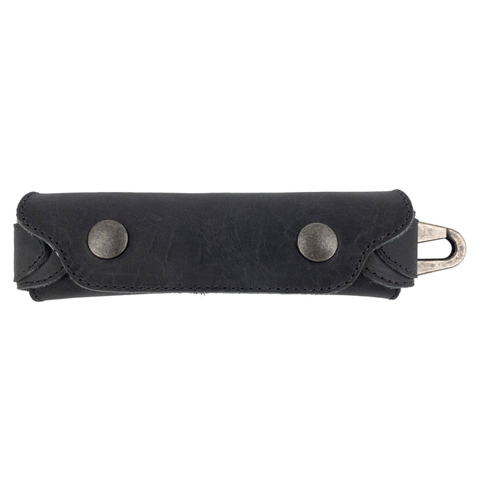 Front view of Hide & Drink’s black Harmonica Case, displaying its sleek design. Made from full grain leather, this stylish instrument cover is perfect for musicians looking for a durable solution. Handmade in La Antigua Guatemala, reflecting quality craftsmanship.