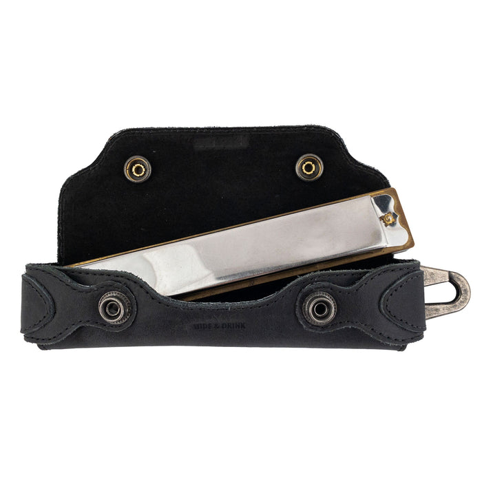 Harmonica Case by Hide & Drink with harmonica fitted inside, showcasing perfect protection. This full grain leather musician accessory is hand cut and sewn, embodying small batch production and quality craftsmanship from La Antigua Guatemala.