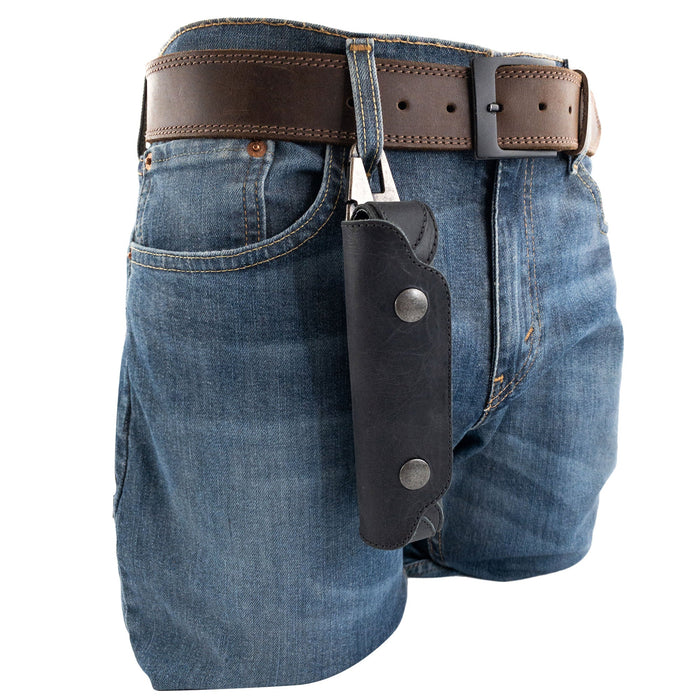Harmonica Case on a belt, illustrating its practicality for musicians on the go. Crafted from full grain leather, this Hide & Drink accessory reflects artisan skills and vintage style, making it an essential musician's item from La Antigua Guatemala.