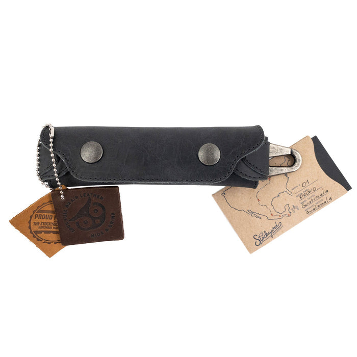 Harmonica Case from Hide & Drink with tags attached, showcasing its unique artisan quality. Made from durable full grain leather, this vintage style instrument cover is an essential for musicians, representing small batch production from La Antigua Guatemala.