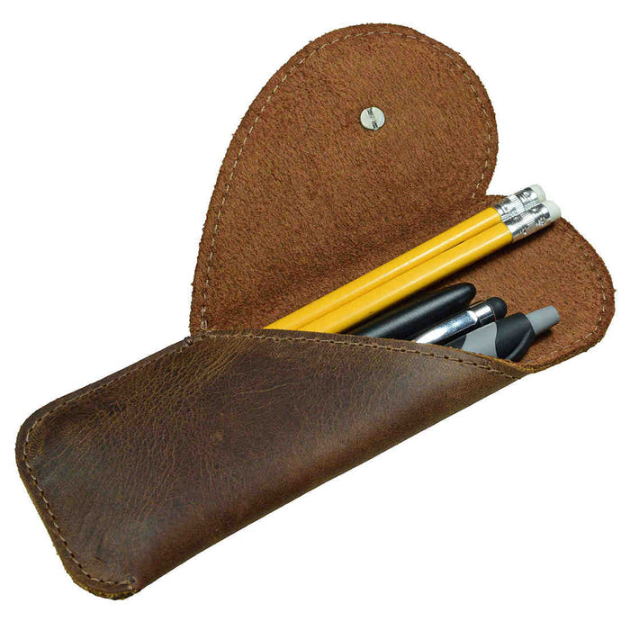 Stylish Heart Pen Case by Hide & Drink, beautifully showcasing the leather craftsmanship, ideal for organizing pencils and pens as a Pencil Organizer. Perfect for office accessories and as a thoughtful gift for bookworms, made from Full Grain Leather through small batch production, hand cut and sewn by skilled artisans in La Antigua Guatemala & Oaxaca Mexico.