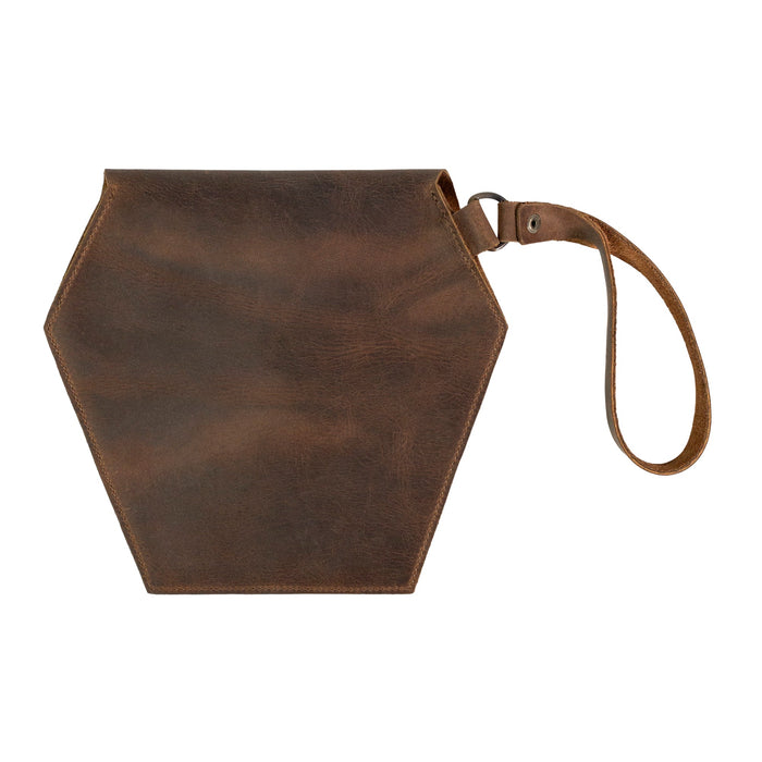 Back view of Heather's Hexagonal Clutch Bag, designed in elegant brown leather. This unique bag with wristlet strap is perfect as a travel handbag for makeup and toiletry items. Each piece is handcrafted from Full Grain Leather, ensuring quality and durability from small batch production in La Antigua Guatemala & Oaxaca Mexico.