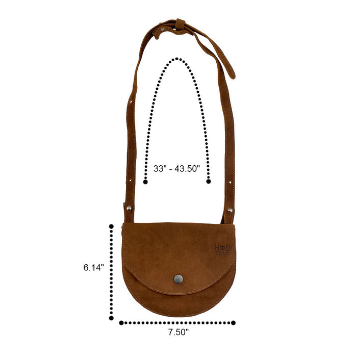 Measurement display for the light tan Hide & Drink Hip and Shoulder Bag, highlighting its dimensions and quality of Full Grain Leather. This artisan bag is crafted through Small Batch Production, featuring hand cut and hand sewn techniques. Handmade in La Antigua Guatemala & Oaxaca Mexico.