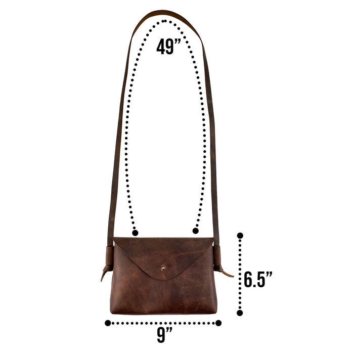 Detailed dimensions of the Horizontal Shoulder Bag from Hide & Drink, showcasing its chic design and functional features. Crafted from Full Grain Leather, this artisan handmade bag epitomizes small batch production, hand cut and sewn by skilled craftspeople in La Antigua Guatemala & Oaxaca Mexico.