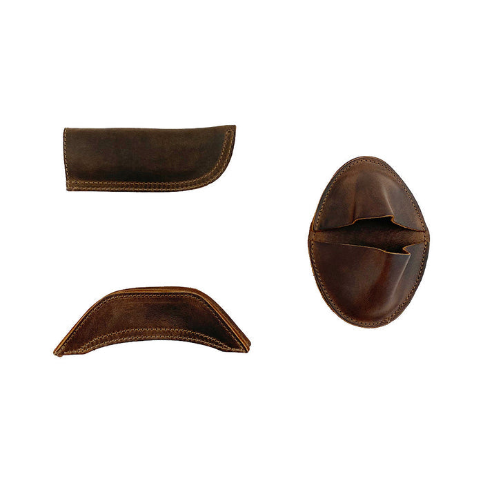 Another view of the Hide & Drink 3 Rustic Hot Handle Holders, including the Panhandle, Side Kick, and Grip Mitt crafted from Full Grain Leather. Ideal for cast iron cookware, this set is part of Small Batch Production, with each item Hand Cut and Hand Sewn by artisan makers in La Antigua Guatemala & Oaxaca Mexico.