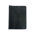 Front view of the black leather Full Grain Leather Journal Cover for Moleskine Cahier XL (7.5 x 9.75 in.) by Hide & Drink. Displaying a sleek finish, this handmade sleeve exemplifies the artistry in notebook cases, crafted with love in La Antigua Guatemala & Oaxaca Mexico.