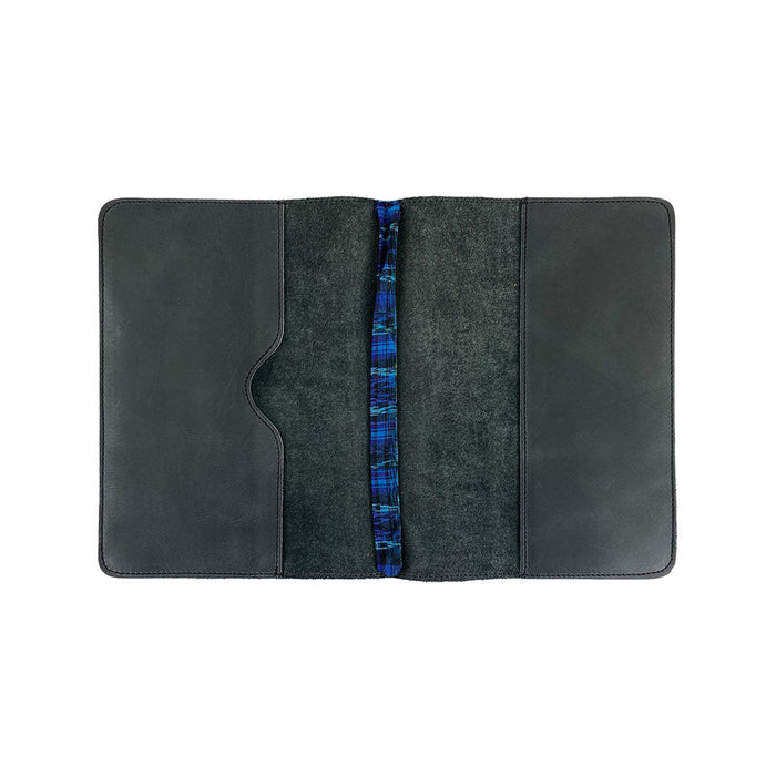 Open view of the interior of the black Full Grain Leather Journal Cover for Moleskine Cahier XL (7.5 x 9.75 in.) by Hide & Drink, featuring beautifully woven bookmark. This meticulous design supports your journaling pursuits while highlighting small batch production values from Mexico.