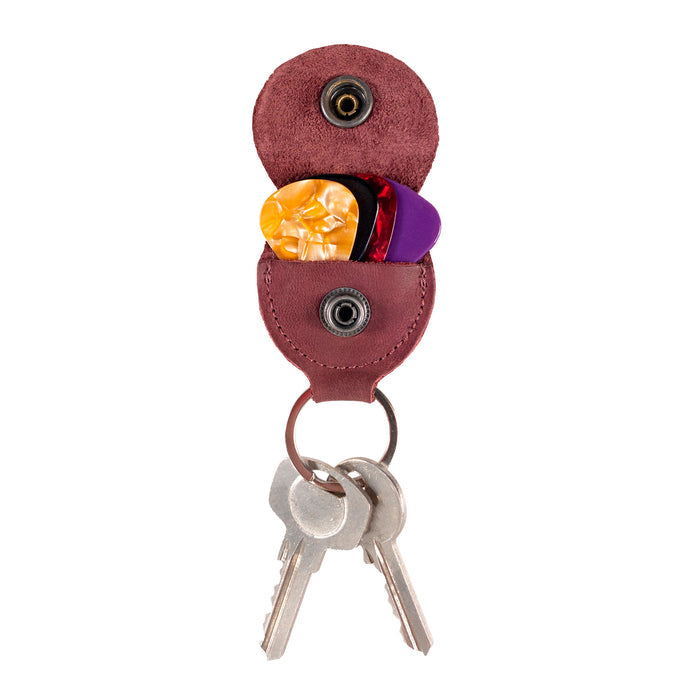Key Chain & Guitar Pick Holder by Hide & Drink featuring a distinct design for easy pick access. This Guitar Pick Holder with Ring is perfect as a key organizer for guitar players, crafted from quality Full Grain Leather. It highlights the values of small batch production, with Hand Cut and Hand Sewn attributes, showcasing a fire branded logo, handmade in La Antigua Guatemala & Oaxaca Mexico.