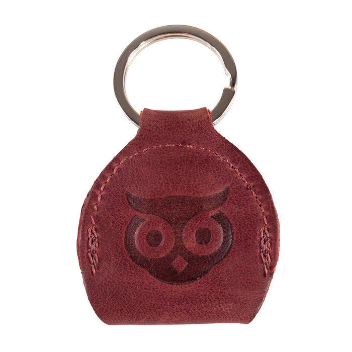 Back view of the Key Chain & Guitar Pick Holder by Hide & Drink illustrating its sturdy construction and design. This Guitar Pick Holder with Ring is a fantastic key organizer for guitar players, made from robust Full Grain Leather. Highlighting small batch production quality, it features Hand Cut and Hand Sewn artistry along with a fire branded logo, handmade in La Antigua Guatemala & Oaxaca Mexico.