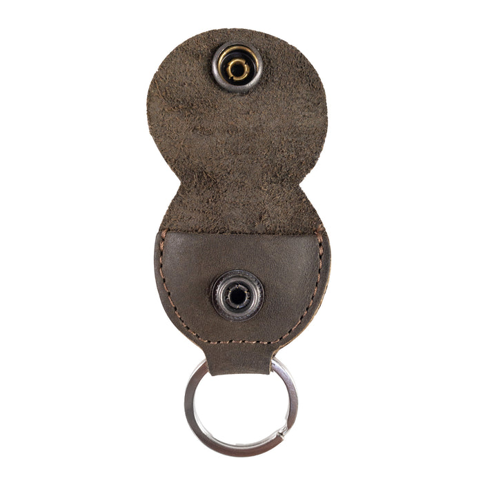 Open view of the Key Chain & Guitar Pick Holder by Hide & Drink displaying vibrant guitar picks. This Guitar Pick Holder with Ring is an essential key organizer for guitar players, made from Full Grain Leather. It represents small batch production, highlighted by Hand Cut and Hand Sewn craftsmanship, with a fire branded design, handmade in La Antigua Guatemala & Oaxaca Mexico.