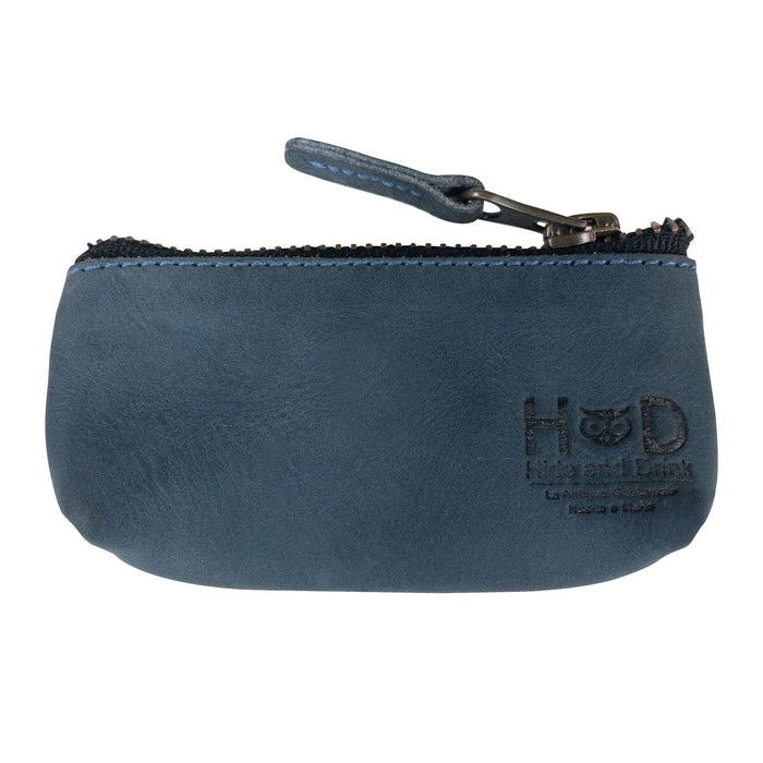 Hide & Drink Key Holder Zippered Pouch in a vibrant shade of brown, ideal for carrying keys or small valuables. A vintage style pouch crafted from full grain leather, showcasing artisan skills.