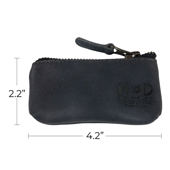 Hide & Drink Key Holder Zippered Pouch showcasing its artisan craftsmanship with attention to detail. Perfect for organizing keys, coins, or charging cables in a vintage style leather.