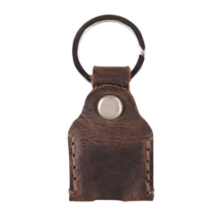 Front view of Hide & Drink Key Holder featuring a sleek button closure and durable Full Grain Leather. This Key Holder is a perfect Keychain Organizer and emergency coin pouch, designed for convenience as a pocket accessory. Artisan-made in La Antigua Guatemala & Oaxaca Mexico with a focus on small batch production.