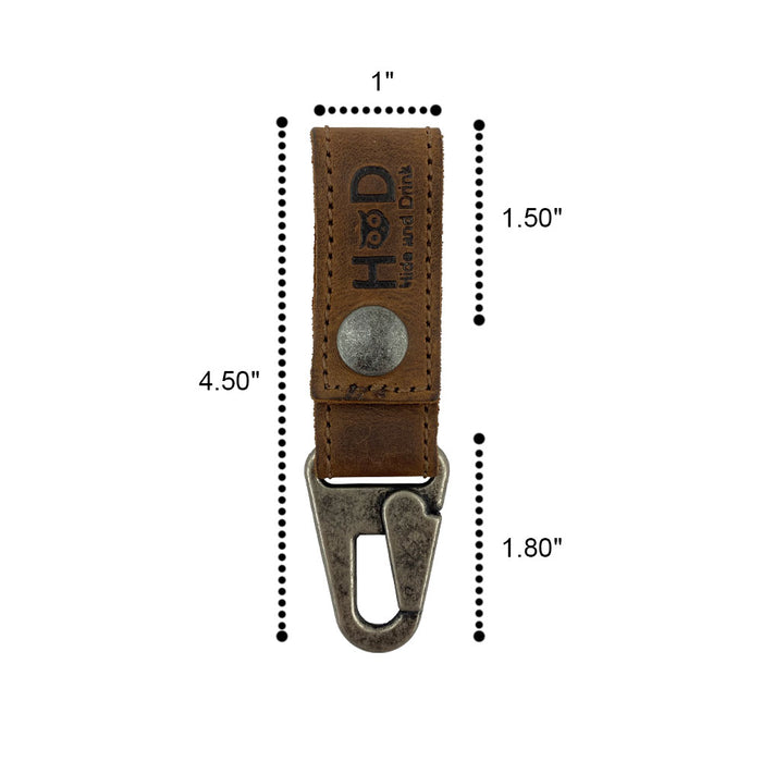 Close up of the dimensions for the Key Ring Holder by Hide & Drink, highlighting its craftsmanship. This Key Ring Holder is made from Full Grain Leather and exemplifies Small Batch Production standards. Each piece is Hand Cut and Hand Sewn, carrying a Fire Branded mark, showcasing Artisan skills with a touch of Handmade elegance from La Antigua Guatemala & Oaxaca Mexico.