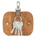 A stylish Key Wrap from Hide & Drink featuring a lobster clasp for easy attachment. This Key Wrap is a perfect keychain holder and pocket accessory made from full grain leather, showcasing small batch production, hand cut and hand sewn craftsmanship. It’s artisan-made and represents the quality of handmade goods from La Antigua Guatemala & Oaxaca Mexico.