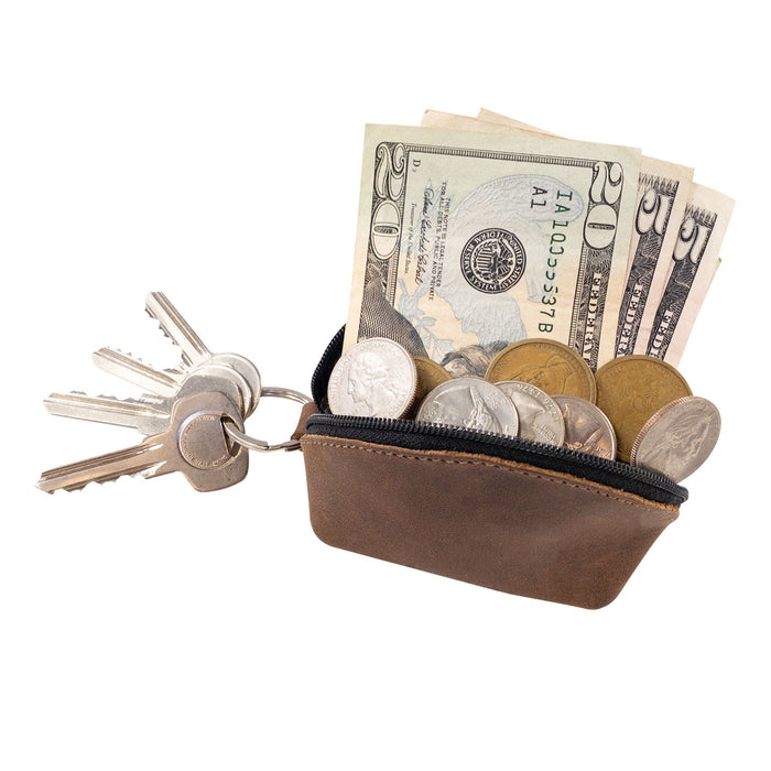Hide & Drink’s Keychain Coin Pouch filled with coins and folded cash, ideal for carrying valuables. Coin Pouch, Keychain, Wallet, Purse, Holder, SD Card, USB, Cash, Case, crafted from Full Grain Leather, handmade by artisans in La Antigua Guatemala & Oaxaca Mexico.