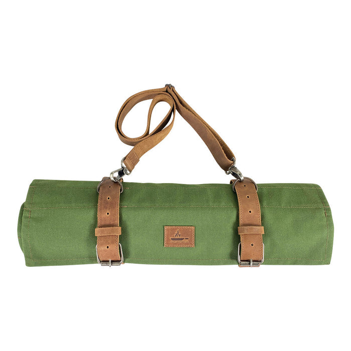 Cast Leather Co. Knife Roll Bag displayed rolled up, showcasing the detachable shoulder strap and durable design. This Knife Roll Bag protects sharp cooking items and is made from water-resistant canvas and full grain leather, artisan crafted in La Antigua Guatemala & Oaxaca Mexico.