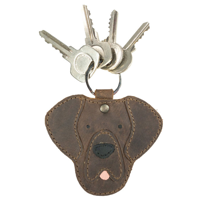 Labrador Dog Critter Keychain by Taco Dog holding keys, displaying its charming design made from Full Grain Leather. This small batch product is artisan-made with intricate hand sewn details, ideal for pet lovers and a great addition for anyone who appreciates handmade items from La Antigua Guatemala.