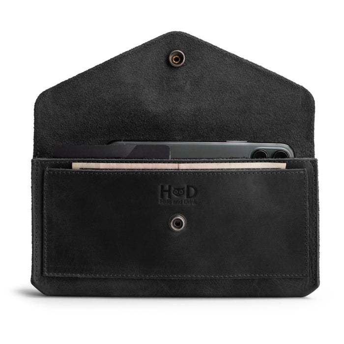 Front view of the Large Female Wallet by Hide & Drink, a stylish Travel Organizer for Women made from Full Grain Leather, featuring a vintage design that showcases craftsmanship from small batch production and handmade methods in La Antigua Guatemala and Oaxaca, Mexico.