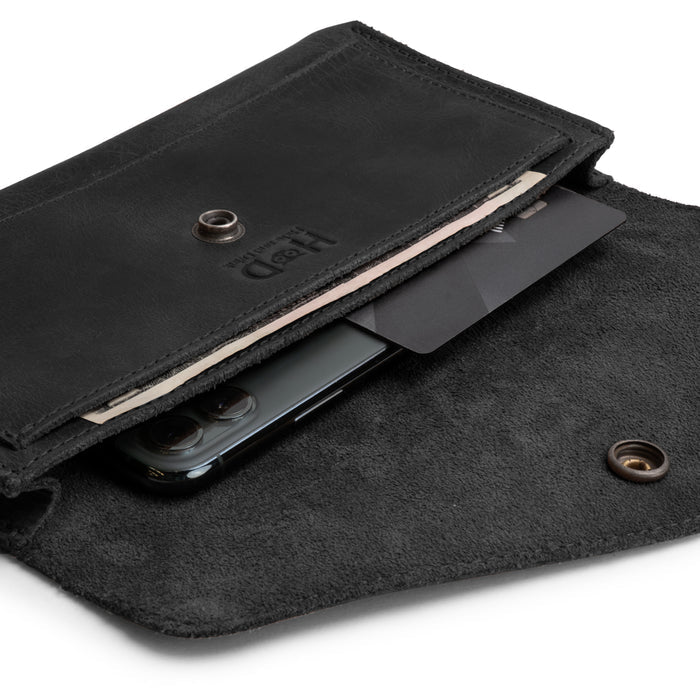 Close-up of the interior of the Large Female Wallet by Hide & Drink, featuring a pocket for cards and cash. This stylish Travel Organizer for Women is crafted from Full Grain Leather and reflects the artisan skills of small batch production.