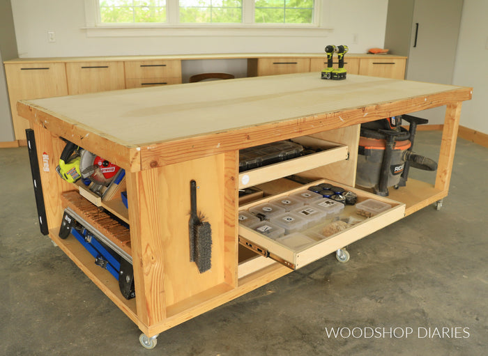 Large mobile workbench with drawer open showing interior storage space