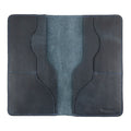 Hide & Drink Large Organizer Wallet closed, displaying the beauty of full grain leather. This handmade bifold wallet offers card slots and a flat money holder, a perfect travel accessory made by local artisans in La Antigua Guatemala & Oaxaca Mexico.