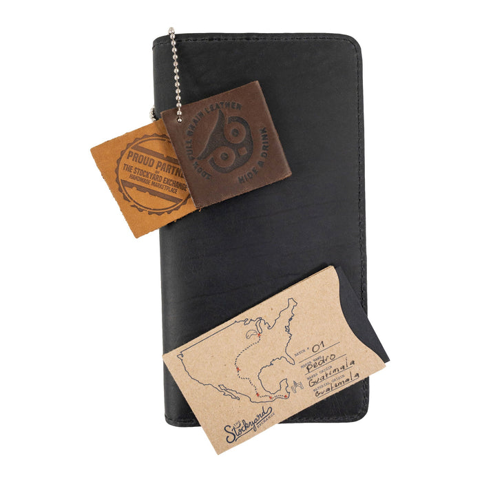 Hide & Drink Large Organizer Wallet emphasizing its quality leather and detailed stitching. This handmade bifold wallet is perfect for organization on the go, crafted from full grain leather in La Antigua Guatemala & Oaxaca Mexico.