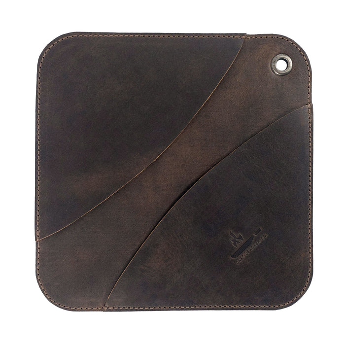 A perfectly crafted Cast Leather Co. Leather Oven Mitt & Trivet, showcasing its minimalist squared design. Made from durable full grain leather, this hot pot pad (potholder) features handmade elements reflecting small batch production and artisanal methods from La Antigua Guatemala.
