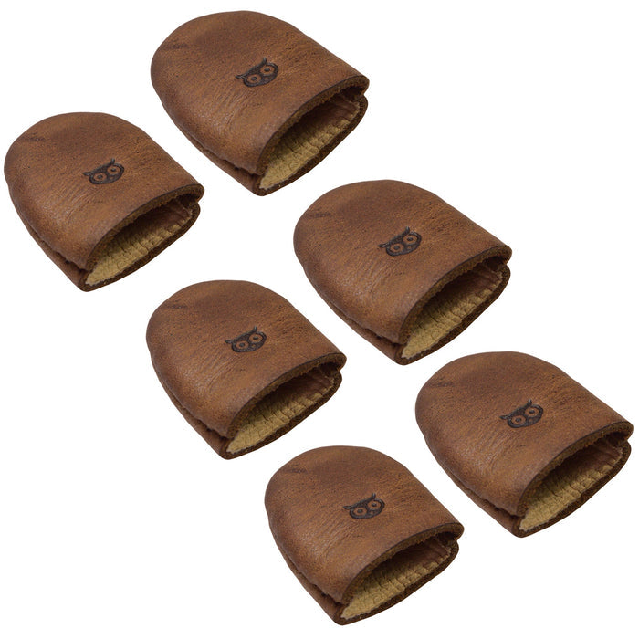 Leather Thimble by Hide & Drink, depicting a Set of 6 Thimbles, perfect as Finger Protectors for crafting projects including Hand Applique & EPP and Quilting Embroidery. Each thimble is made from durable Full Grain Leather, showcasing the quality of Small Batch Production with Hand Cut and Hand Sewn techniques, Fire Branded, and crafted in La Antigua Guatemala & Oaxaca Mexico.