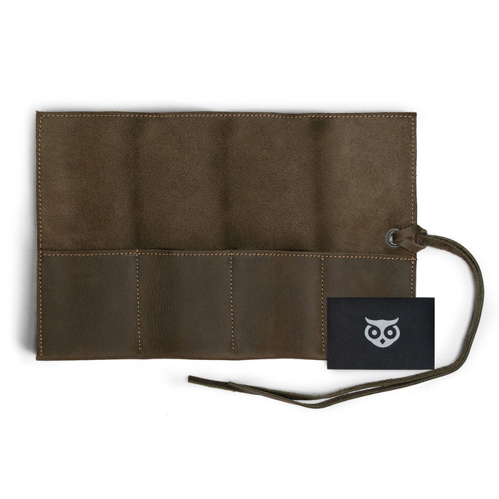 Handmade black Watch Roll by Hide & Drink, holds up to 4 watches. This easy carry Watch Roll Organizer is crafted from full grain leather, representing the beauty of small batch production, hand cut, hand sewn, and fire branded detailing made in La Antigua Guatemala & Oaxaca Mexico.
