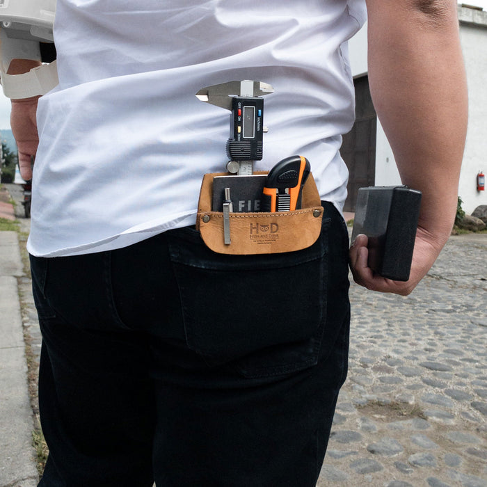 Hide & Drink Leather Work Pocket displayed in an outdoor setting, showcasing its versatility. This artisan-crafted Leather Work Pocket ensures you stay organized while on the go.