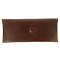 Heather's Long Utility Pouch, a stylish wallet for carrying and storing cash, coins, and cards. This vintage, minimalist style clutch is made from full grain leather, showcasing the unique craftsmanship of StockyardX with small batch production. Hand cut and hand sewn, this artisan piece is fire branded, perfect for those seeking handmade goods from La Antigua Guatemala.