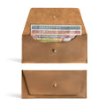 The Long Utility Pouch in navy blue by Hide & Drink, emphasizing its sleek design and luxury feel. Perfect for organized storage of cash, coins, and cards.