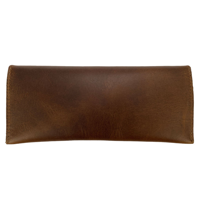 Back view of Heather's Long Utility Pouch, highlighting the full grain leather craftsmanship. This stylish wallet for carrying and storing cash, coins, and cards features a vintage, minimalist design and is part of StockyardX's small batch production. Each piece is hand cut and sewn, showcasing artisan quality from La Antigua Guatemala.