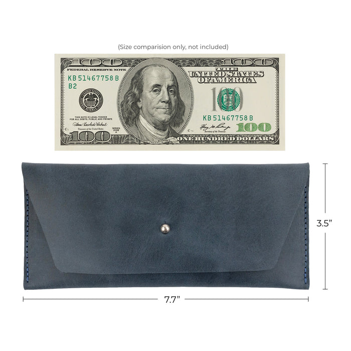 Dimensions of the maroon Long Utility Pouch by Hide & Drink next to a hundred dollar bill, displaying its size and effectiveness as a stylish wallet.