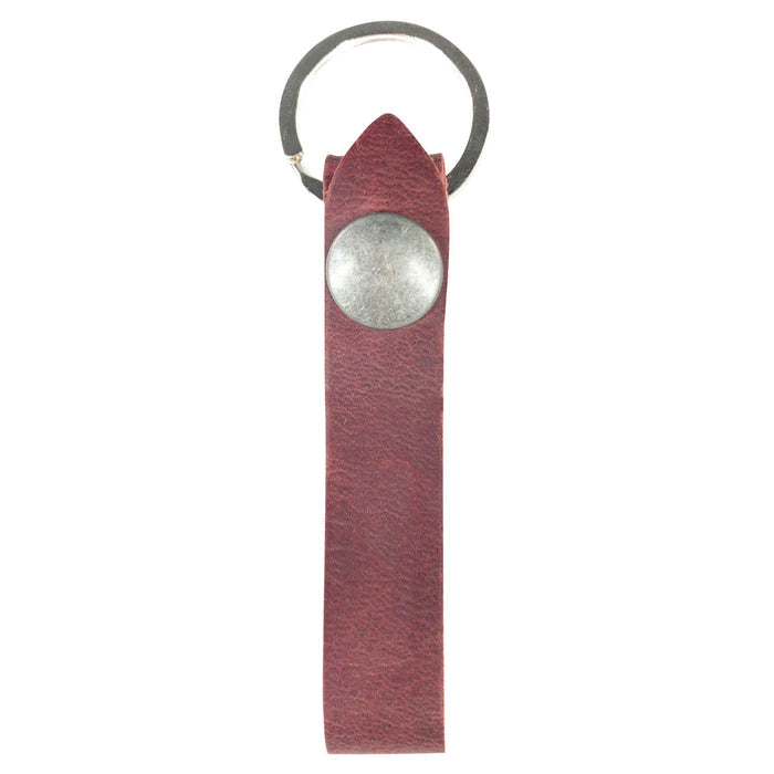 Hide & Drink Loop Keychain presented with business cards and showcasing artisan detail. This rustic keychain with belt loop is made from full grain leather, crafted in La Antigua Guatemala & Oaxaca Mexico using small batch production.