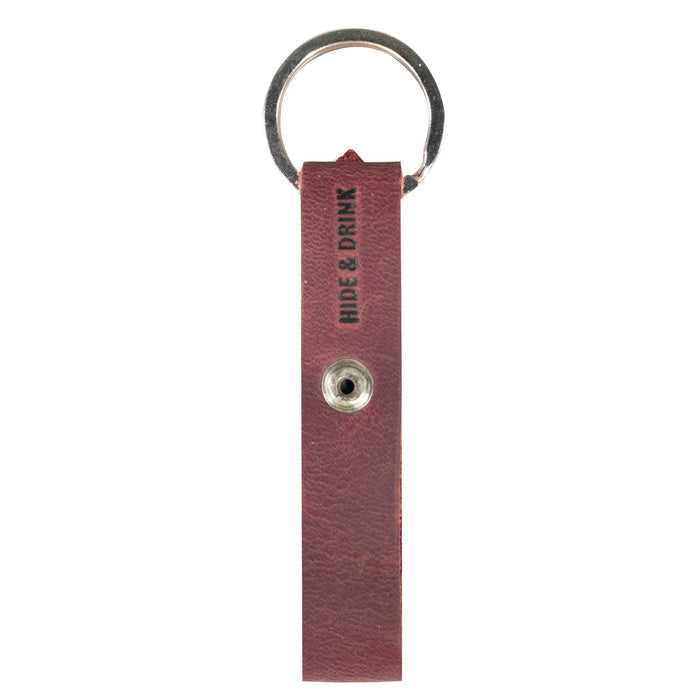Hide & Drink Loop Keychain featuring a sleek olive green design ideal for organizing keys. This artisan crafted rustic keychain with belt loop is made of full grain leather in La Antigua Guatemala & Oaxaca Mexico.