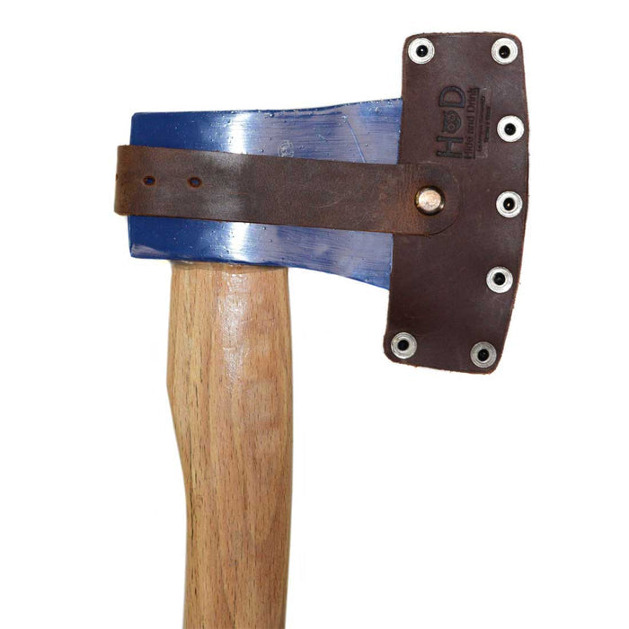 Hide & Drink's Lumberjack Axe Sheath with a beautiful leather finish, showcasing its adjustable strap and rustic design. This protector holster is made from full grain leather, emphasizing the care of small batch production and artisan craftsmanship in La Antigua Guatemala.
