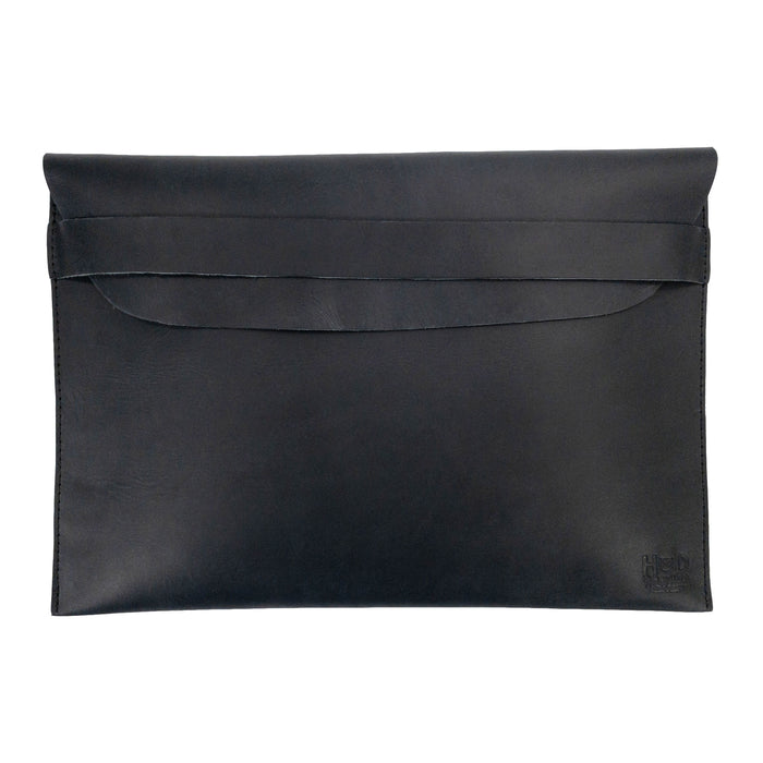 Sleek design of the Hide & Drink MacBook Slim Case in black, showcasing its fine full grain leather texture. Perfect for MacBook Air/Pro 13 Inch with M1 Chip, this artisan case highlights hand cut, hand sewn quality and is lovingly crafted in La Antigua Guatemala.