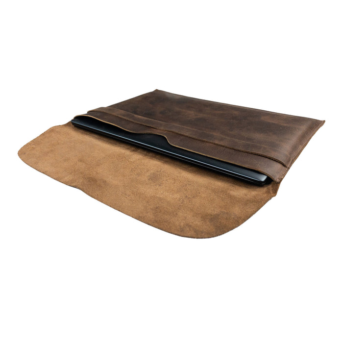 Open view of the Hide & Drink MacBook Slim Case, demonstrating its secure fit for MacBook Air/Pro 13 Inch with M1 Chip. This rustic leather case features hand sewn construction, making it both stylish and functional, a true artisan creation made in La Antigua Guatemala.