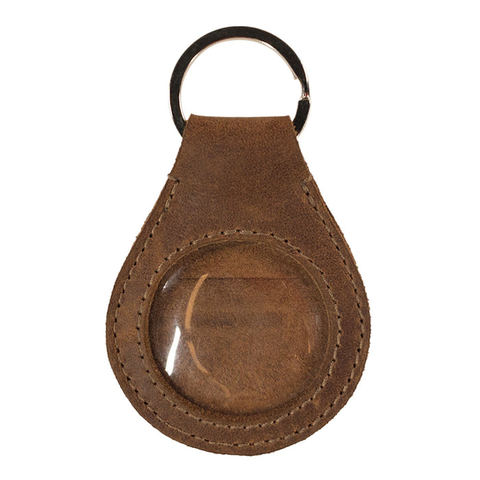Close-up view of the Medallion Holder Keychain by Hide & Drink featuring a secure keyring attachment designed for storing memorabilia, keepsakes, and special coins. This handmade accessory is crafted from full grain leather, showcasing the artisan quality from small batch production in La Antigua Guatemala & Oaxaca Mexico.