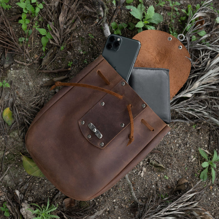 Open view of a Full Grain Leather Medieval Style Belt Bag by Valhalla Gear, displaying its spacious interior designed as a perfect Camping Pouch for Essentials. This Waist Bag combines Artisan craftsmanship with Small Batch Production, Hand Cut, Hand Sewn, and Fire Branded techniques, showcasing its Handmade nature in La Antigua Guatemala & Oaxaca Mexico.